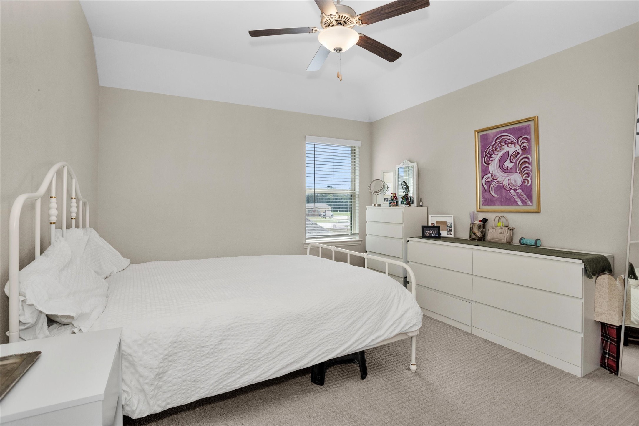 7451 Bethpage Lane Spring, TX 77389 - Photo 24 of 31 a bedroom with a bed and a dresser