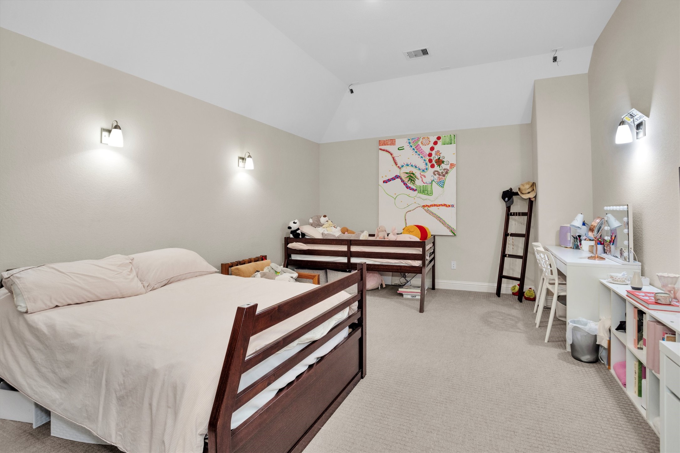 7451 Bethpage Lane Spring, TX 77389 - Photo 27 of 31 a bedroom with bed and a book shelf