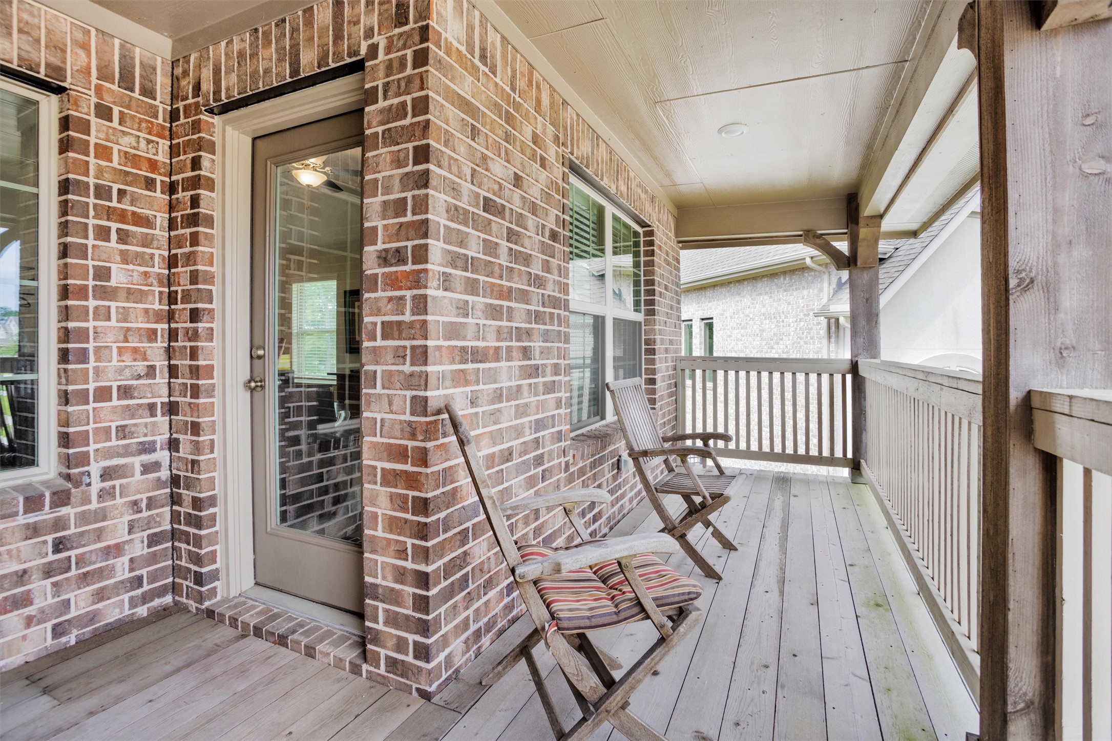 7451 Bethpage Lane Spring, TX 77389 - Photo 28 of 31 a view of a balcony with wooden floor