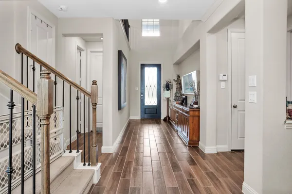 a kitchen with stainless steel appliances granite countertop a refrigerator a stove a sink and a microwave