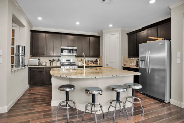 a kitchen with a stove and a microwave