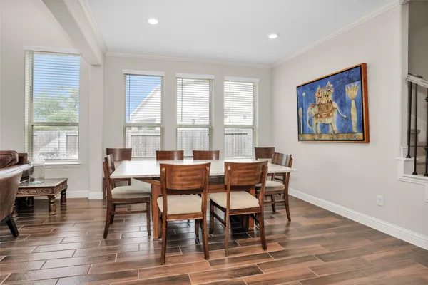 a view of a a dining room with furniture window and outside view