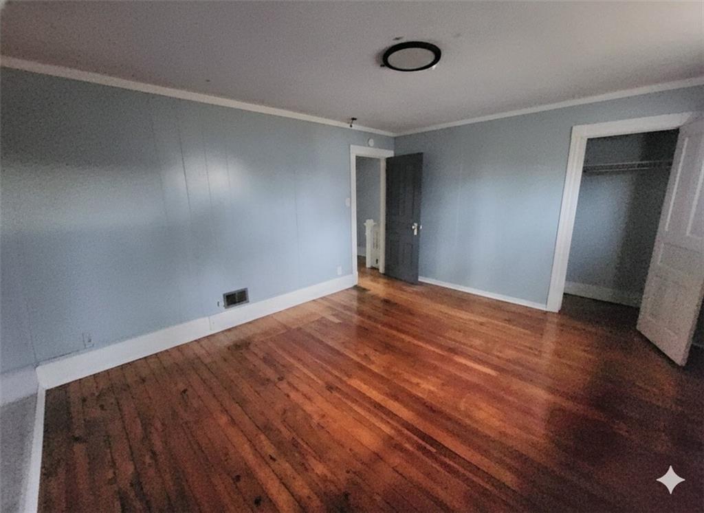 703 French Street Farrell, PA 16121 - Photo 8 of 14 a view of empty room with wooden floor