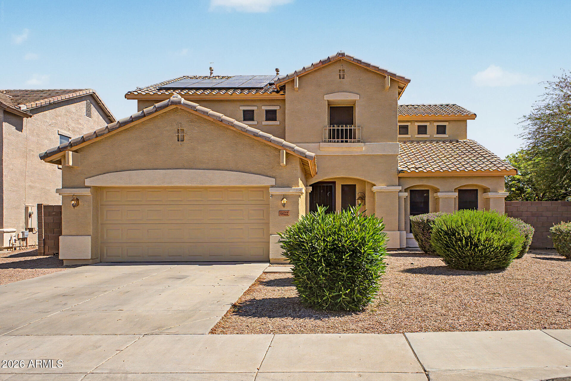 6622 West Harwell Road Laveen, AZ 85339 - Photo 1 of 32 a front view of a house with a yard and garage