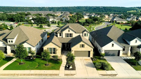 a view of a brick house with many windows