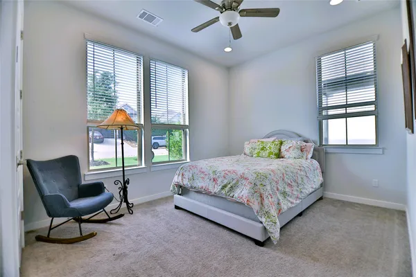 a bathroom with a tub sink and shower