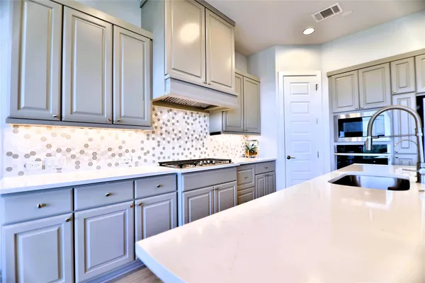 a view of a hallway with wooden floor and stairs