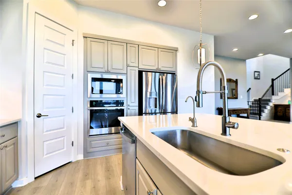 a view of a bedroom with a bed and a window