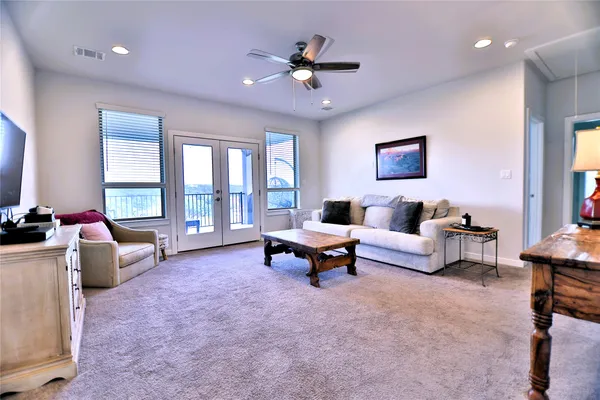 a front view of a house with a garden and plants