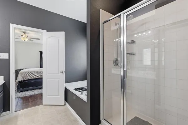 a bathroom with a shower and a sink