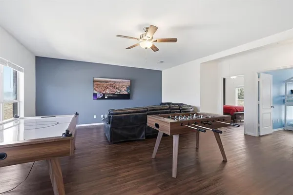 a view of a dining room with furniture and wooden floor