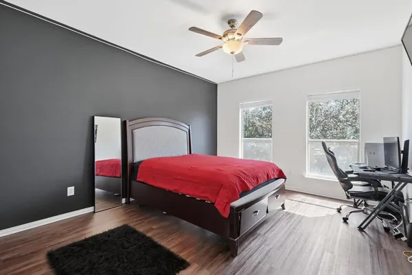 a bed room with a bed and a chair