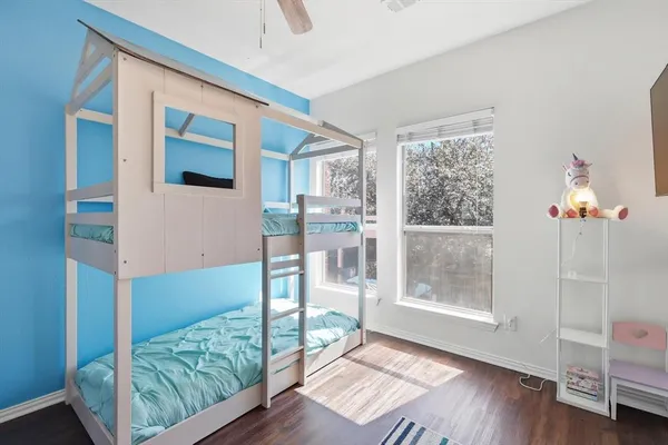 a view of an entryway with wooden floor and door
