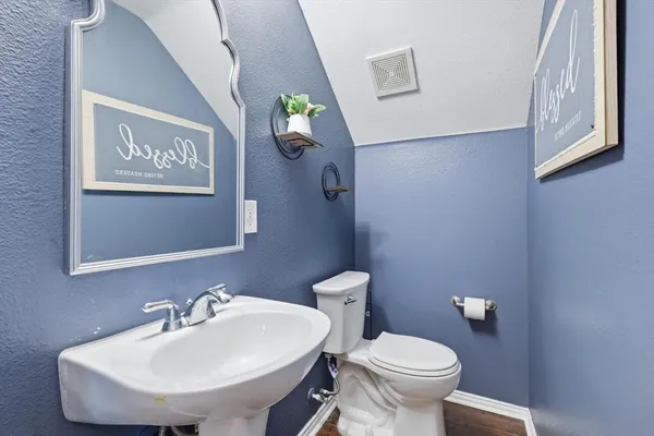 a bathroom with a toilet and a sink