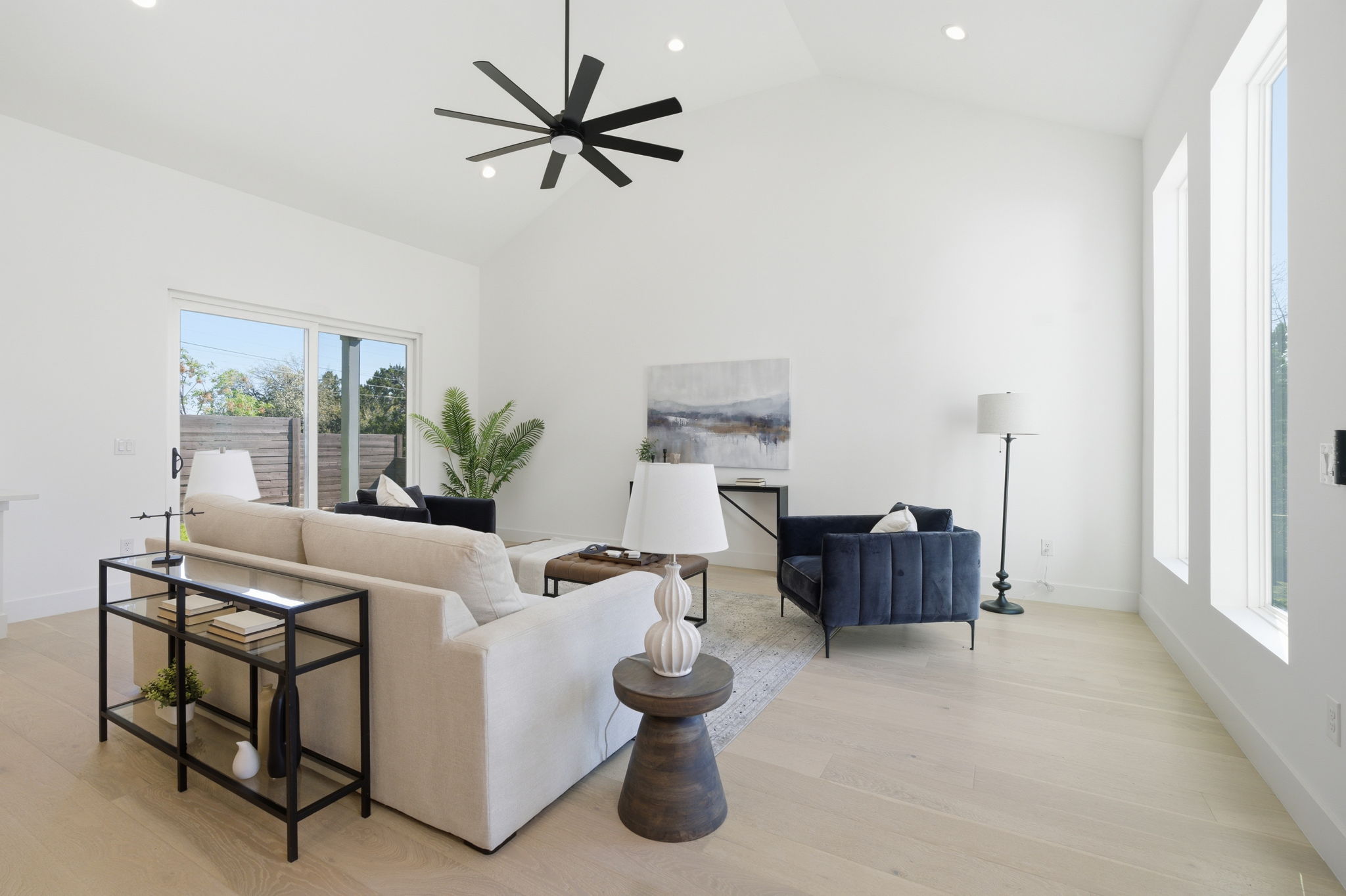400 Post Rd Drive Austin, TX 78704 - Photo 3 of 23 Living room featuring light wood-type flooring, a ceiling fan, recessed lighting, and vaulted ceiling