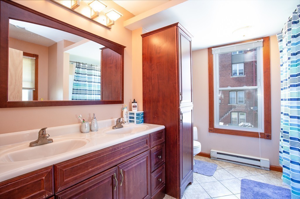 38-40 Rapalus Street Springfield, MA 01151 - Photo 8 of 25 a bathroom with a sink and a mirror
