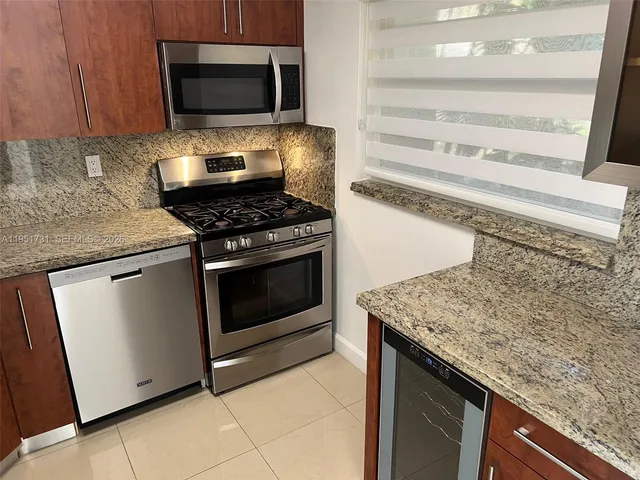 a kitchen with a stove and a microwave