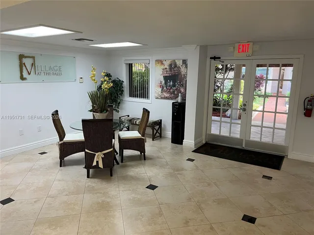 a front view of a house with a yard and fountain