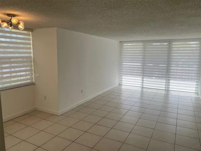 a view of a room that has a window in it