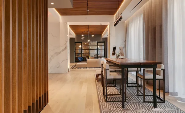a dining room with a table and chairs