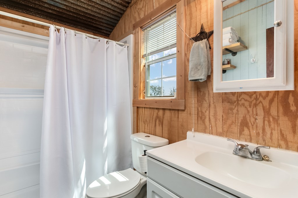 3527 Old Harper Road Fredericksburg, TX 78624 - Photo 16 of 43 a bathroom with a sink and a mirror