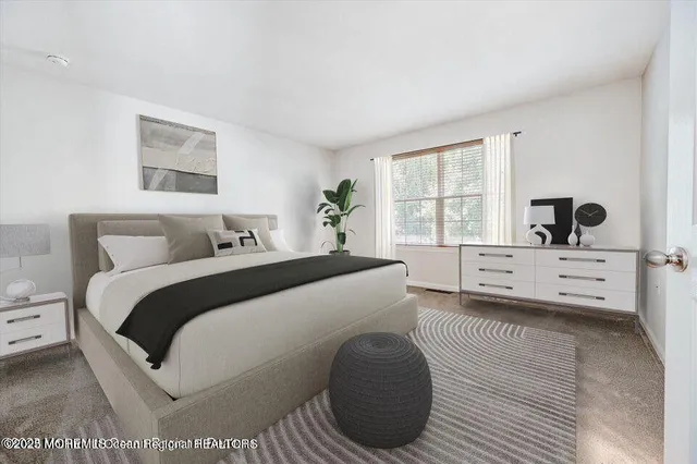 a spacious bedroom with a bed and a window