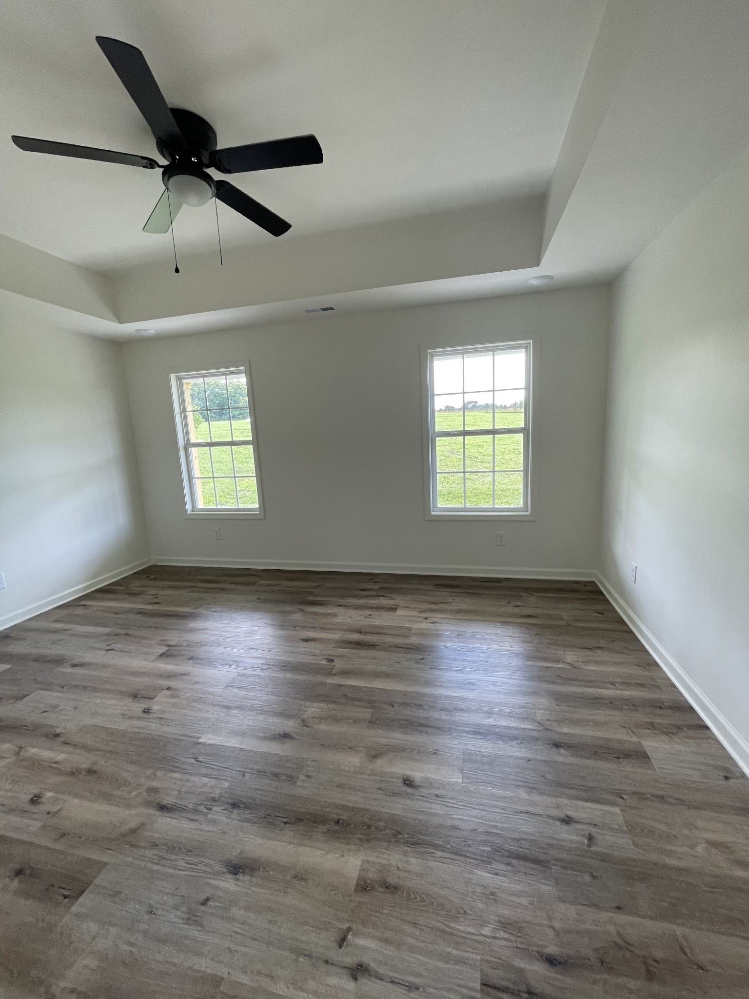 2907 Union Camp Road Lafayette, TN 37083 - Photo 13 of 24 an empty room with wooden floor and windows