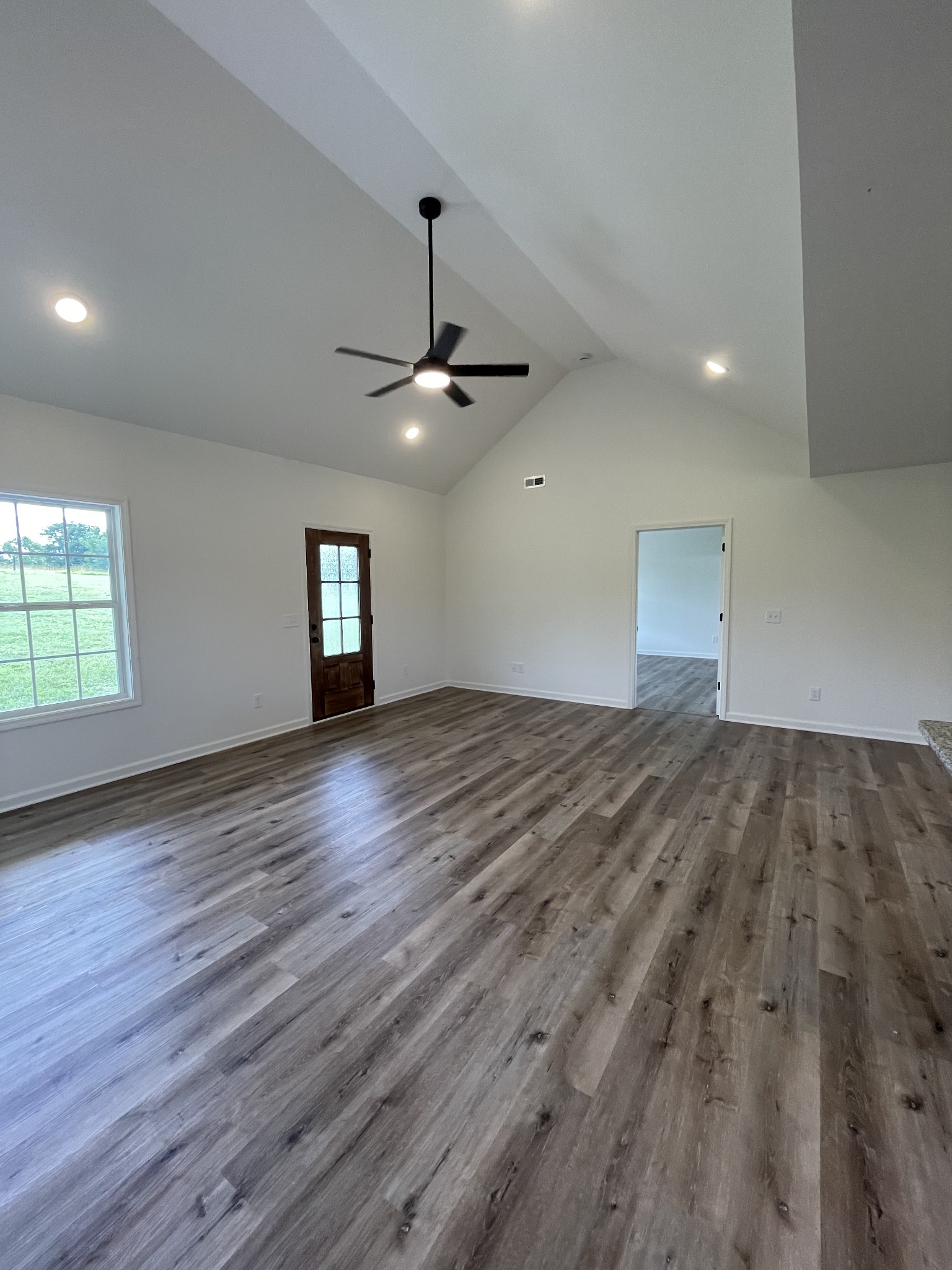 2907 Union Camp Road Lafayette, TN 37083 - Photo 18 of 24 an empty room with wooden floor and windows