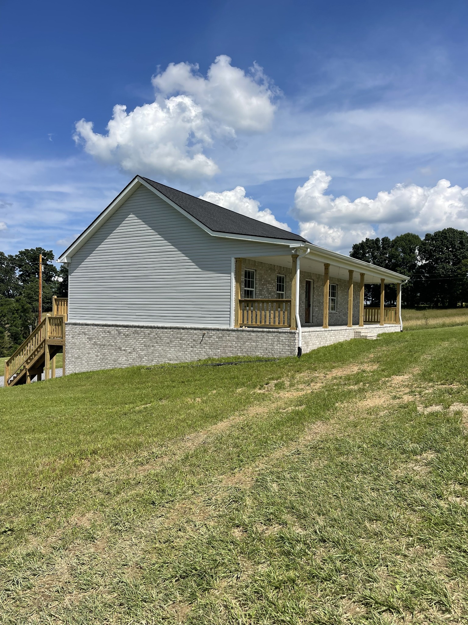 2907 Union Camp Road Lafayette, TN 37083 - Photo 2 of 24 a view of a house with a yard and sitting area