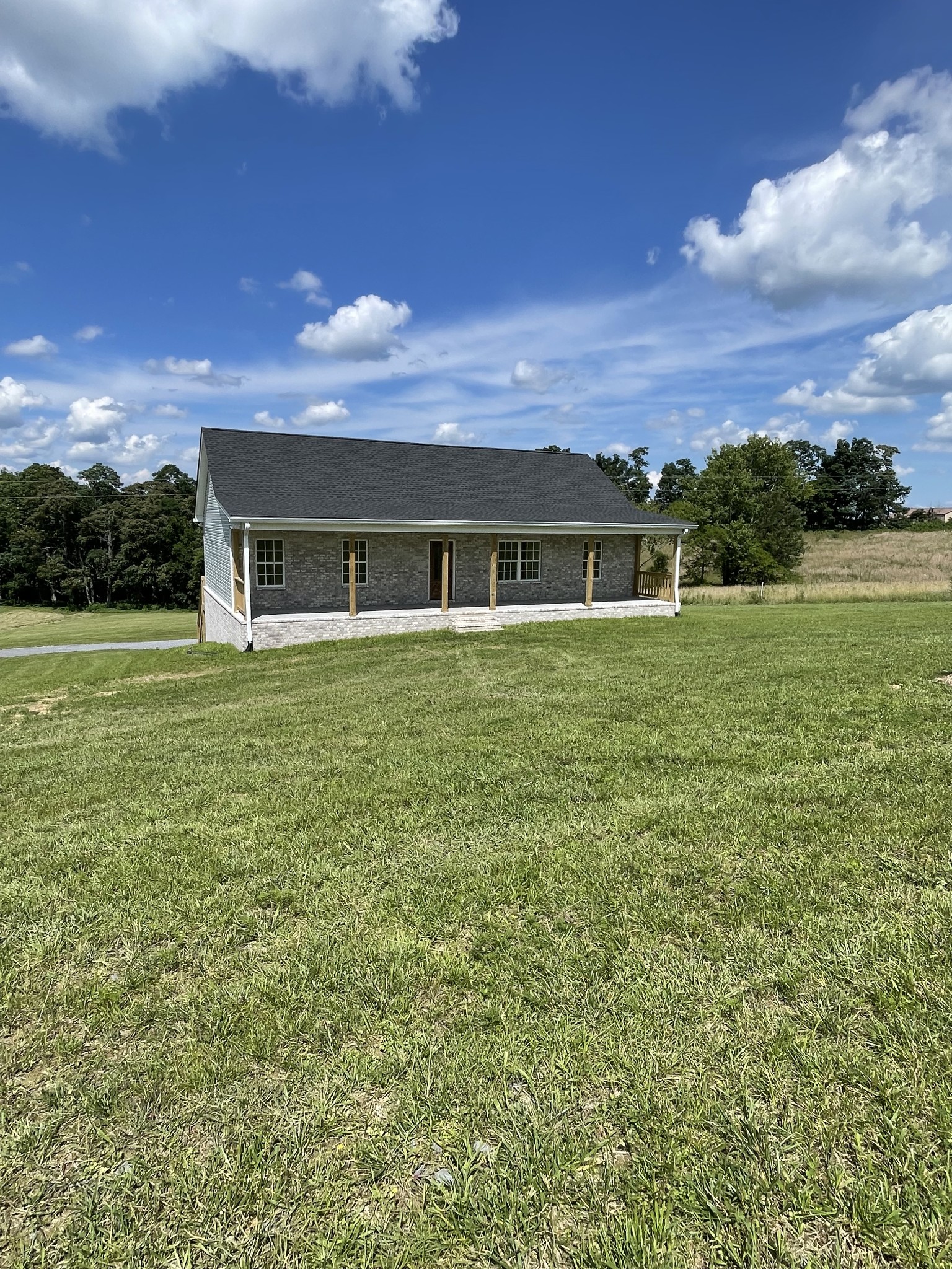 2907 Union Camp Road Lafayette, TN 37083 - Photo 3 of 24 a view of a big house with a big yard