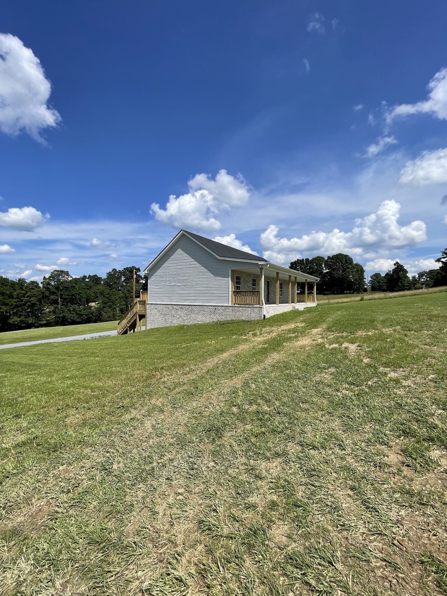 2907 Union Camp Road Lafayette, TN 37083 - Photo 4 of 24 a front view of house with yard and lake