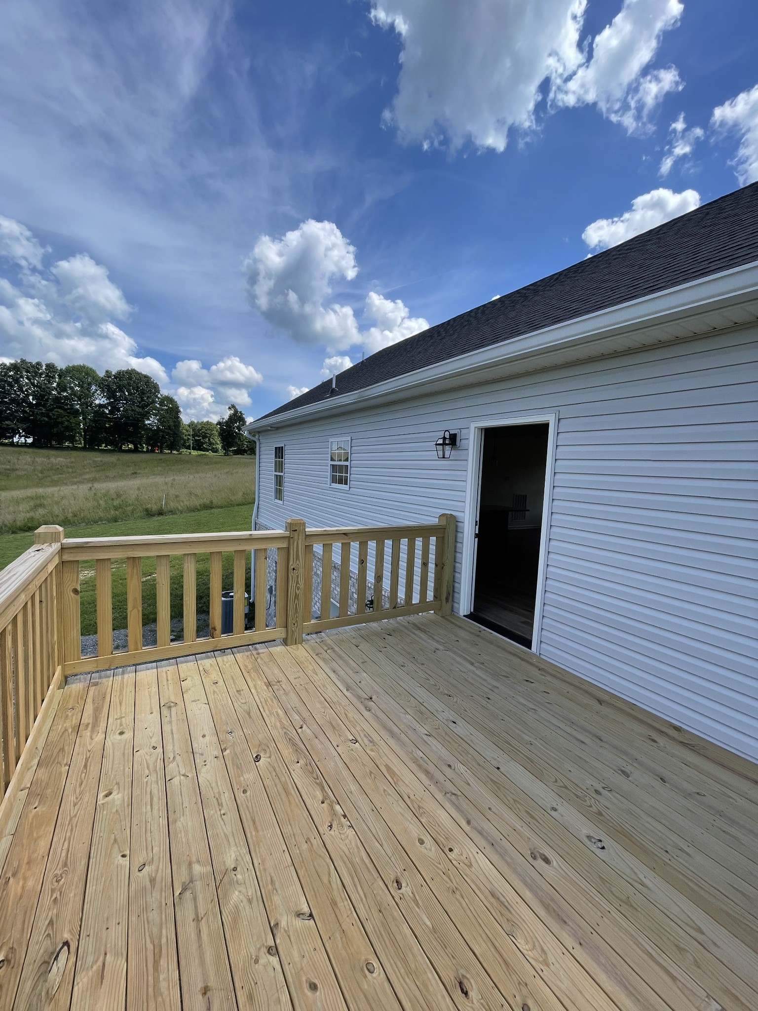 2907 Union Camp Road Lafayette, TN 37083 - Photo 6 of 24 a view of a balcony with wooden floor and city view