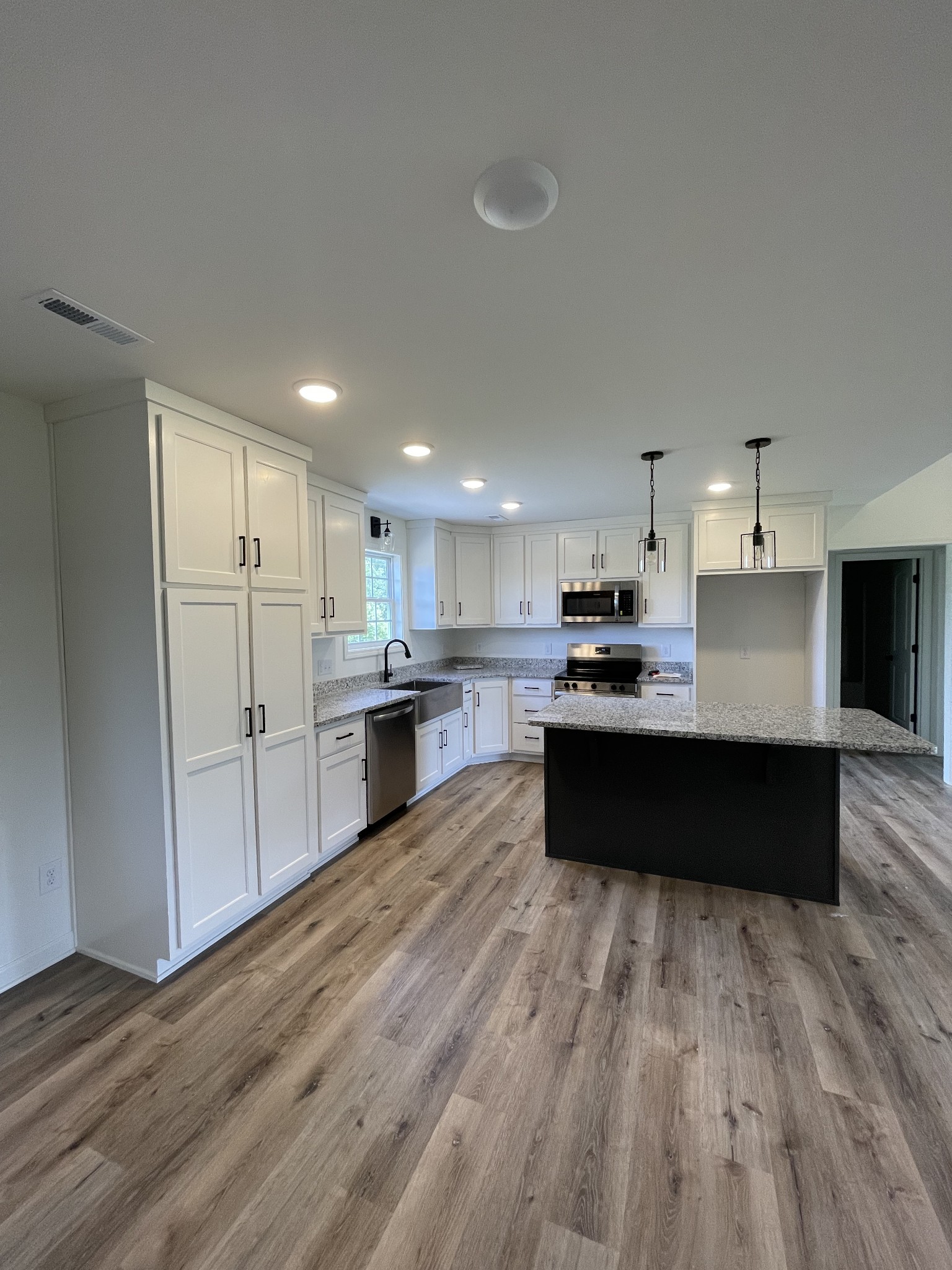 2907 Union Camp Road Lafayette, TN 37083 - Photo 10 of 24 a large kitchen with a lot of counter space and stainless steel appliances