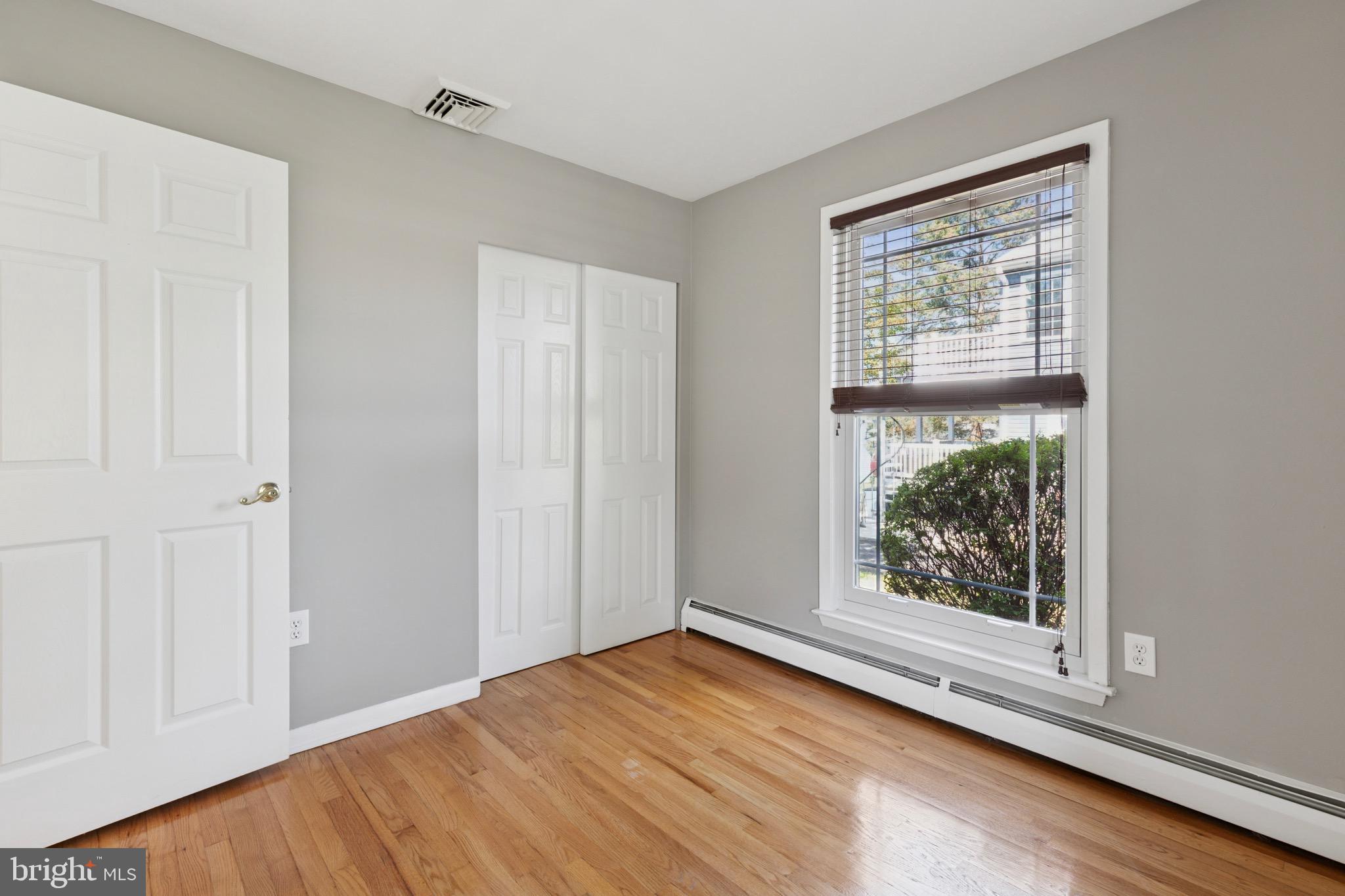 756 Churchville Road Southampton, PA 18966 - Photo 11 of 19 a view of an empty room with wooden floor and a window