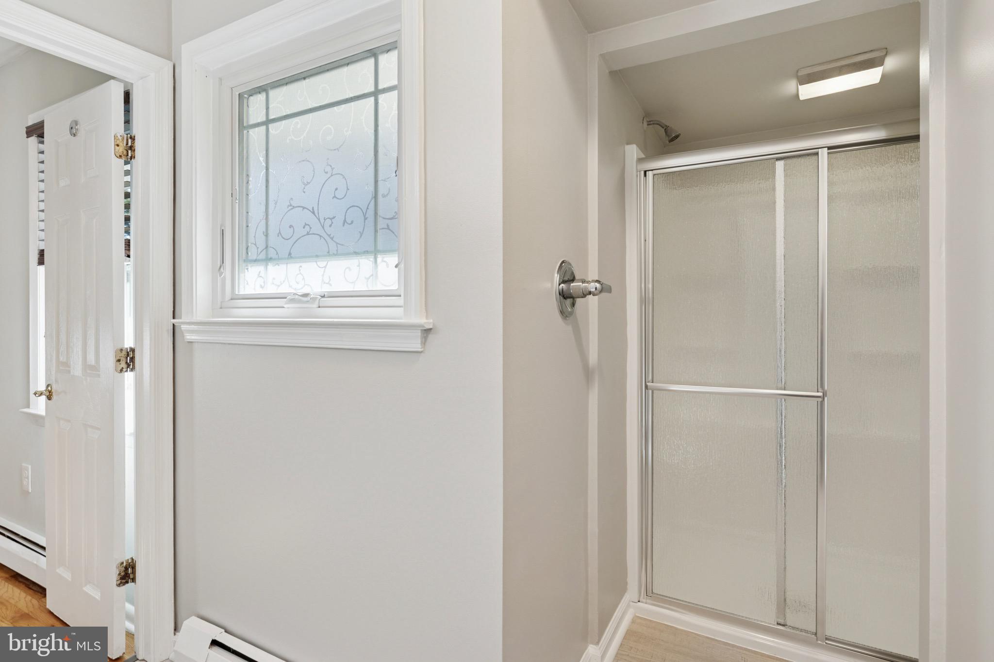 756 Churchville Road Southampton, PA 18966 - Photo 13 of 19 a view of a bathroom with a glass shower door