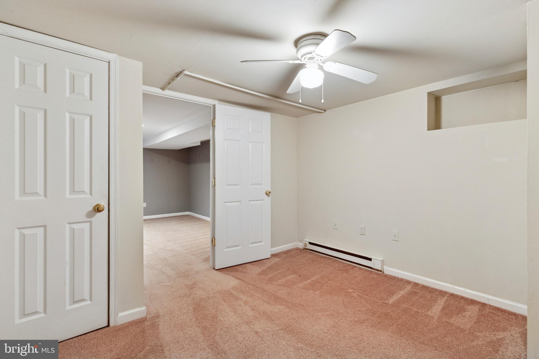 756 Churchville Road Southampton, PA 18966 - Photo 16 of 19 an empty room with a ceiling fan and a window