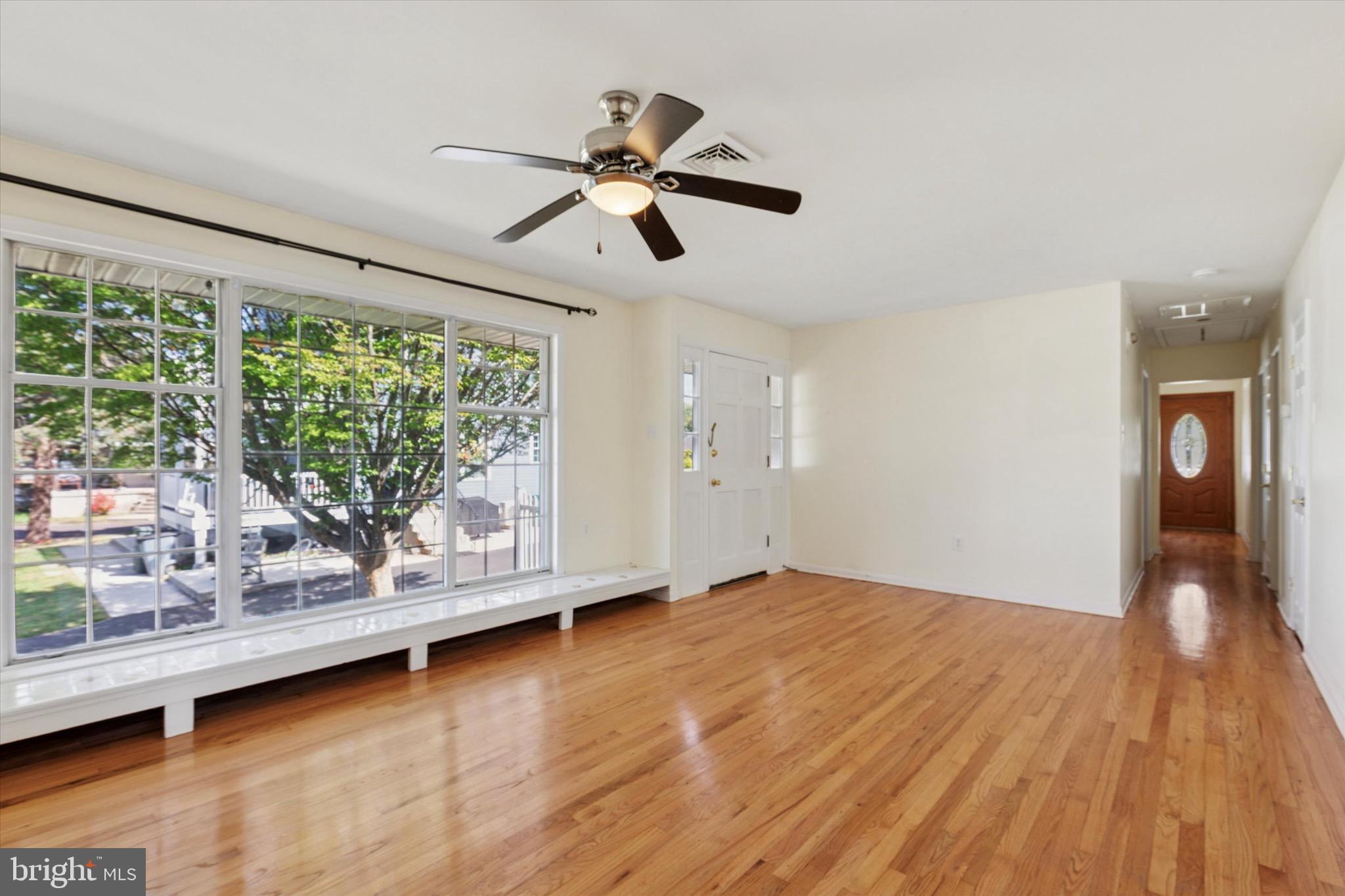 756 Churchville Road Southampton, PA 18966 - Photo 4 of 19 a view of an empty room with wooden floor and a window