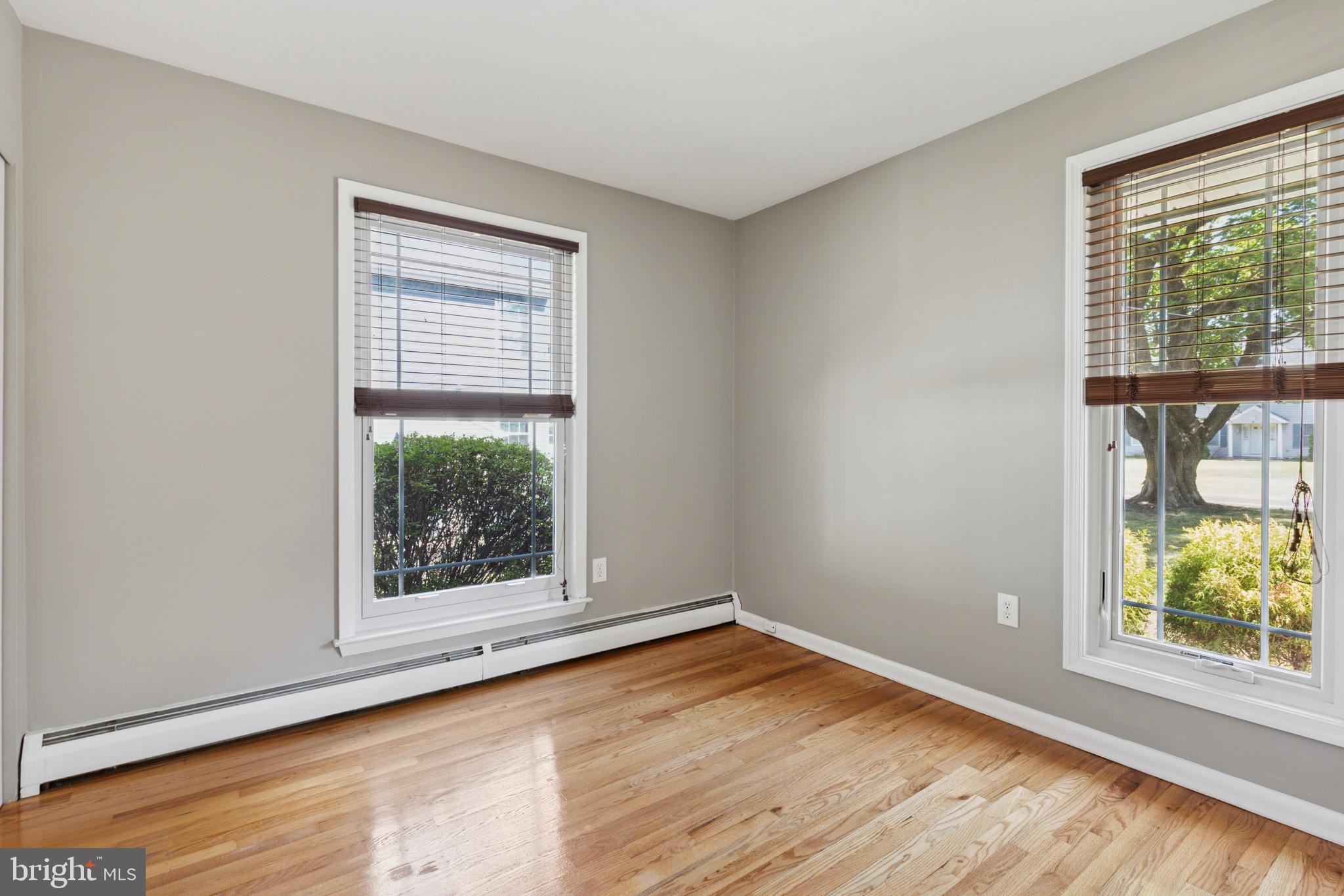 756 Churchville Road Southampton, PA 18966 - Photo 10 of 19 an empty room with wooden floor and windows