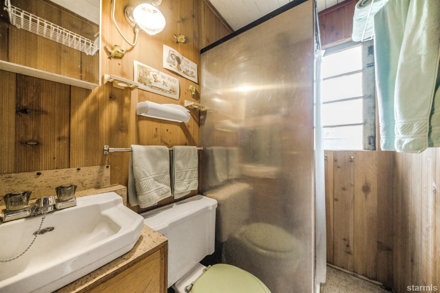 31960 Kit Carson Road, Unit 54 Pioneer, CA 95666 - Photo 11 of 21 a bathroom with a sink toilet and shower
