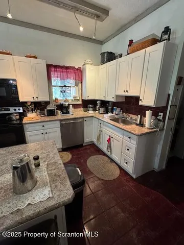 a view of a room with furniture and wooden floor