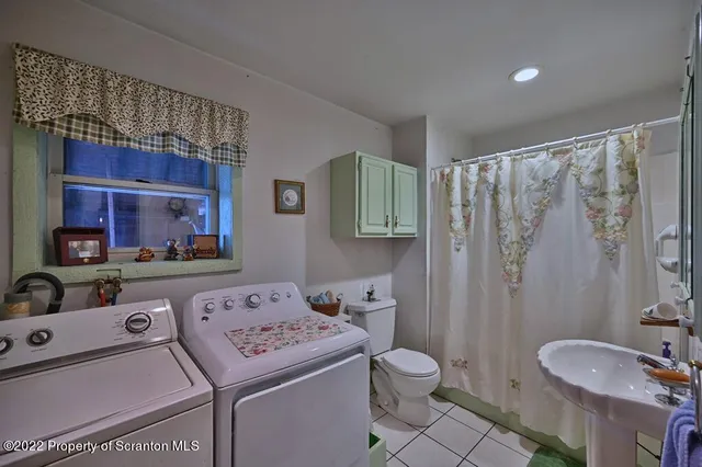 a kitchen with a sink cabinets and window