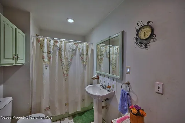 a kitchen with stainless steel appliances granite countertop a stove refrigerator and cabinets