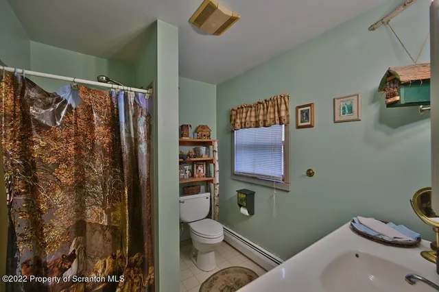 a bedroom with a bed a desk and chair