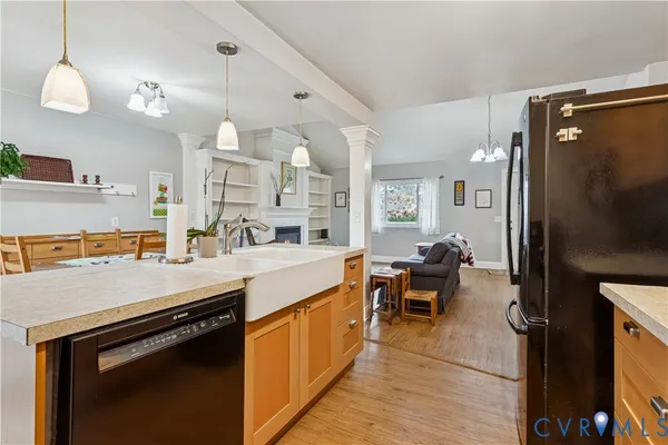 a kitchen with a sink appliances and cabinets