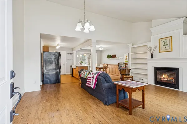 a spacious bedroom with a bed and a fireplace