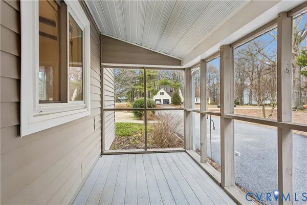 a view of a large window with wooden floor