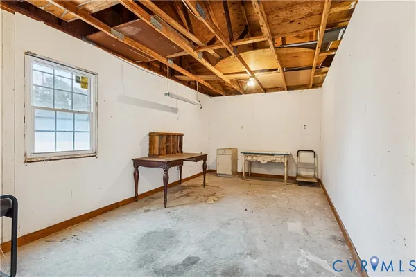 a view of livingroom with furniture and a window