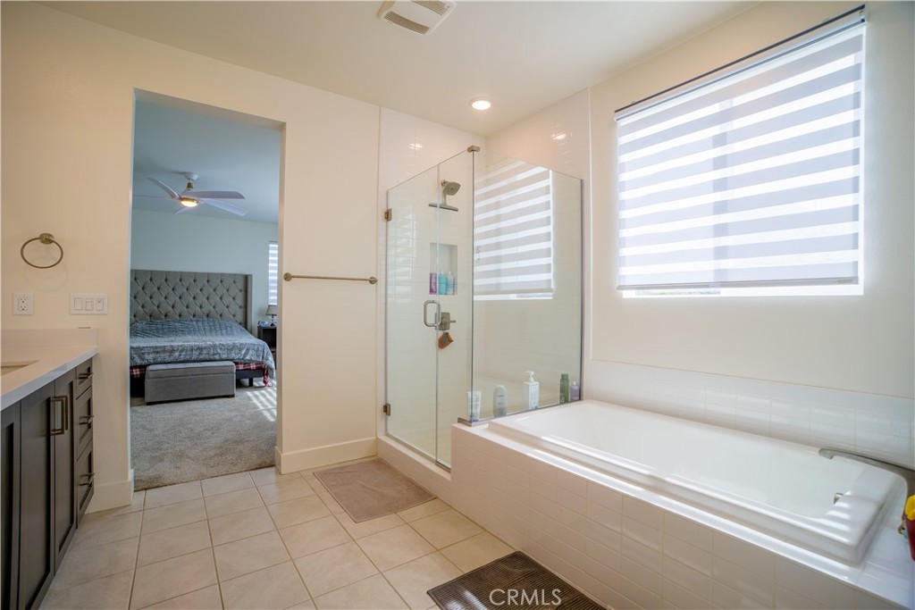 35323 Orchard Trail Fallbrook, CA 92028 - Photo 15 of 30 a bathroom with a tub shower and sink