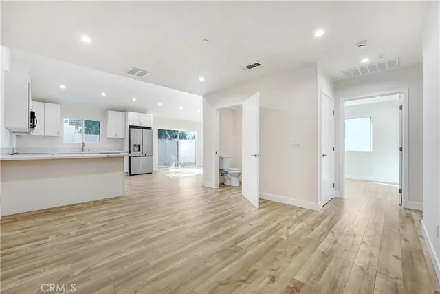 a view of a bedroom with washer and dryer