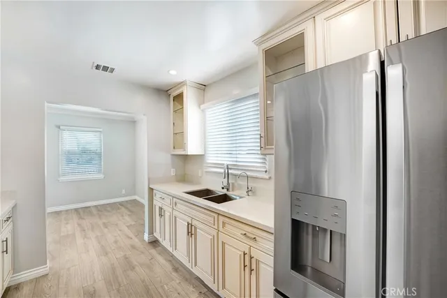 a kitchen with stainless steel appliances a stove sink microwave and refrigerator